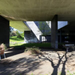 OPERA | Design Matters' Escola de Medicina, Universidade do Minho, showcasing a modern architectural design with extensive daylighting, shaded areas, and integrated groundcover on the surrounding land lot.