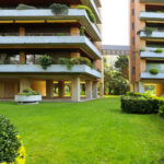 Unknown Architect’s Apartment Building Rua de João Paulo Freire showcasing a modern residential condominium with multiple balconies, landscaped garden courtyard, and well-maintained yard within an estate setting.