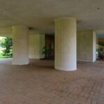 Unknown Architect’s Apartment Building Rua de João Paulo Freire showcasing concrete columns, shaded areas, landscaping with plantation, and ample daylighting.