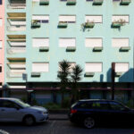 Colorful high-rise apartment buildings on Rua António José da Costa featuring vibrant painted façades, balconies, and urban condominium design elements.