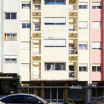 Colorful apartment buildings on Rua António José da Costa featuring composite materials, concrete structures, glass balconies, and vibrant façades.