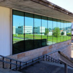Unknown Architect’s Restaurante Panorâmico at Universidade do Minho showcasing a concrete structure with composite material elements and extensive daylighting features.