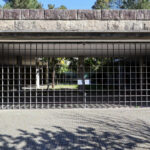 Unknown Architect’s Restaurante Panorâmico at Universidade do Minho showcasing a concrete and brickwork structure with stone and flagstone walls, cobblestone driveway, and limestone building materials.