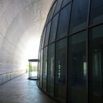 Unknown Architect’s Serviços de Ação Social at Universidade do Minho showcasing a steel dome structure with extensive daylighting and transparent glass elements emphasizing modern design and scientific architecture.