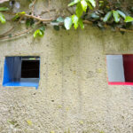 Unknown Architect’s Shower House Parque da Cidade showcasing a minimalist concrete wall with smooth painted surfaces.