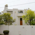 Unknown Architect’s Casa 1 Rua Viana Lima showcasing a minimalist design with concrete walls, composite material cladding, plaster finishes, and an external staircase.