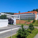 Unknown Architect’s Escola de Economia e Gestão at Universidade do Minho showcasing a modern campus building with a glass façade and clean, geometric lines integrated into an urban design setting.