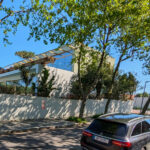 Unknown Architect’s Villa Avenida Sacadura Cabral showcasing a modern concrete structure with composite materials, balconies, and integrated shading elements enhancing daylighting.