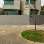 Unknown Architect’s Villa I Praça de Liége showcasing a composite material and concrete structure with plaster finishes and large daylighting elements.