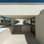 Nuno Brandao Costa’s 7 Houses in Óbidos at Bom Sucesso Resort showcasing modern composite and concrete materials with plaster finishes, daylighting effects, and distinct shadow patterns highlighting the architectural design.