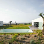 Nuno Graça Moura’s 13 Villas at Bom Sucesso Resort showcasing modern estate landscaping with sleek villa structures and integrated green spaces.