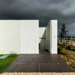 Nuno Graça Moura’s 13 Villas at Bom Sucesso Resort showcasing composite material and concrete construction with daylighting effects, shadows, and interconnected walkways.