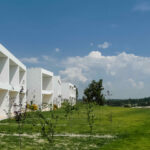 Nuno Graça Moura’s 24 Row Houses at Bom Sucesso Resort showcasing modern daylighting techniques with clean lines and large windows for natural light.
