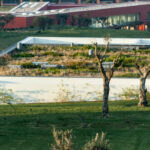 Nuno Graça Moura’s design of the 2 Villas at Bom Sucesso Resort showcasing modern landscaping with clean lines and integration into the natural surroundings.