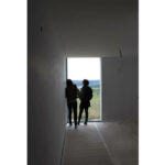 Atelier dos Remédios, Madalena Cardoso de Menezes, and Francisco Teixeira Bastos’ 5 Casa K /360 Villas at Bom Sucesso Resort showcasing modern daylighting techniques with sharp shadow patterns on the minimalist façade.