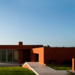 Atelier dos Remédios, Madalena Cardoso de Menezes, and Francisco Teixeira Bastos’ 6 Casa L Villas at Bom Sucesso Resort showcasing modern daylighting with large glass façades and minimalist structural design.
