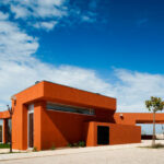 Atelier dos Remédios, Madalena Cardoso de Menezes, and Francisco Teixeira Bastos’ 6 Casa X Villas at Bom Sucesso Resort featuring modern composite materials, concrete structures, orange accents, engineered shading elements, and innovative daylighting design.