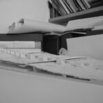 Josep Llinás’s House Model 2 showcasing a modern design with a minimalist grey and silver color palette, featuring clean lines and a sleek, paper-inspired aesthetic.