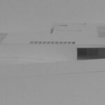 Josep Llinás’s House Model 3 showcasing a sleek silver composite material exterior with a modern architectural design and detailed structural plan.