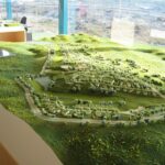 Gonçalo Cardoso de Menezes’ Former Sales Office at Bom Sucesso Resort shown in a bird's-eye aerial view highlighting the building’s modern angular design and integration with surrounding landscape.