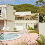 Casa Veiga / Casa Portufornia, Colares by Manuel Tainha, Rui Costa Martins (3742) Manuel Tainha and Rui Costa Martins' Casa Veiga / Casa Portufornia showcasing a modern villa with spacious balconies, glass façades, and shaded courtyards blending eco-friendly design with luxury estate elements.