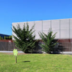 Gonçalo Byrne’s Utopia Villa 3 showcasing a concrete corporate headquarters with composite materials, extensive daylighting, landscaped public spaces, and engineered shading elements.