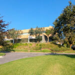 "Quinta da Barca Row House 1 "" Casa do Pinhal"" ", Esposende by João Alvaro Rocha (3723) João Alvaro Rocha’s Casa do Pinhal showcasing a modern residence with a landscaped garden, shaded lawn, driveway, and surrounding trees and shrubs.