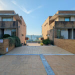 Quinta da Barca Marina Building , Esposende by João Alvaro Rocha (3713) João Alvaro Rocha’s Quinta da Barca Marina Building showcasing a modern residential complex with composite material walls, urban design elements, and multiple apartment units in a suburban human settlement.