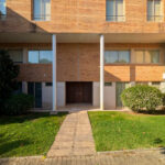 Quinta da Barca Marina Building , Esposende by João Alvaro Rocha (3732) João Alvaro Rocha’s Quinta da Barca Marina Building showcasing a residential apartment complex with brick façades, landscaped lawns, shaded walkways, and a well-maintained yard within a human settlement.