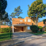 Quinta da Barca Villa 2, Esposende by João Alvaro Rocha (3717) João Alvaro Rocha’s Quinta da Barca Villa 2 showcasing a modern residential estate with a landscaped garden, expansive lawn, shaded yard, and a sleek driveway in a suburban setting.