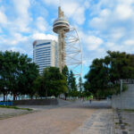 Torre Vasco da Gama, Lisboa by Profabril, Leonor Janeiro, Nick Jacobs (3685) Profabril, Leonor Janeiro, and Nick Jacobs' Torre Vasco da Gama, a high-rise skyscraper with a sleek glass façade and distinctive tower structure, serving as a corporate headquarters and urban landmark in a bustling metropolis during daytime.