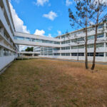 Vítor Figueiredo’s design of Escola Superior de Artes e Design showcasing a modern campus building with a glass façade, daylighting features, and a combination of apartment and commercial building elements in an urban setting.