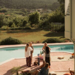 Casa Veiga / Casa Portufornia, Colares by Manuel Tainha, Rui Costa Martins (3790) Casa Veiga by Manuel Tainha and Rui Costa Martins showcasing a modern leisure backyard with outdoor furniture, shaded garden areas, and people enjoying nature.