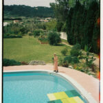 Casa Veiga / Casa Portufornia, Colares by Manuel Tainha, Rui Costa Martins (3760) Manuel Tainha and Rui Costa Martins' Casa Veiga / Casa Portufornia showcasing a modern backyard with a swimming pool, landscaped garden, shaded leisure area, and water features integrated into the lawn and yard.