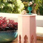 Casa Veiga / Casa Portufornia, Colares by Manuel Tainha, Rui Costa Martins (3780) Manuel Tainha and Rui Costa Martins' Casa Veiga / Casa Portufornia showcasing a modern pink pedestal structure with integrated houseplants in flowerpots.