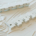 Atelier dos Remédios, Madalena Cardoso de Menezes, and Francisco Teixeira Bastos’ 18 Red Architectural Townhouses, Lot 215, showcasing a detailed scale model with a clear plan and design layout.