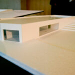 Nuno Graça Moura’s scale model of the 8 Architectural Villas, Lot 80 project showcasing detailed composite material assemblies with plywood elements and a clear architectural plan.