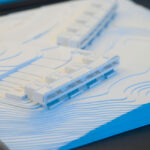 Atelier dos Remédios, Madalena Cardoso de Menezes, and Francisco Teixeira Bastos’ 18 Architectural Townhouses, Lot 215, showcasing a modern design with clean lines and a planned arrangement of multiple townhouse units.