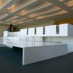 Gonçalo Byrne’s "6 Unbuilt Villas, Lot 209" showcasing a detailed scale model with transparent composite material floors highlighting modern architectural design and interior layout.