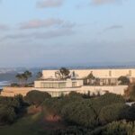 Alcino Soutinho’s 10 Architectural Villas, Lot 240, showcasing a modern estate villa with clean lines, large glass façades, and integration into the hinterland landscape.