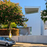 Alcino Soutinho’s Cavadas Santos Residence showcasing a modern residential design with a spacious balcony overlooking the surrounding area.