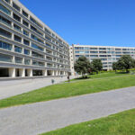 Alcino Soutinho’s Conjunto Habitacional Palácio da Enseada showcasing a high-rise residential complex with modern urban design, featuring glass façades, integrated public spaces, and a metropolitan condominium setting.