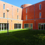 Alcino Soutinho's Department of Ceramics and Glass Engineering at the University of Aveiro showcasing a modern design with a lawn and artificial turf on the campus.