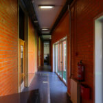 Alcino Soutinho's Department of Ceramics and Glass Engineering at the University of Aveiro showcasing a brick and wood exterior with visible brickwork and hardwood elements.