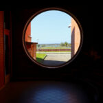 Alcino Soutinho's Department of Ceramics and Glass Engineering at the University of Aveiro showcasing a symmetrical design with a brown brick exterior, hardwood elements, and ample daylighting.