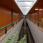 Alcino Soutinho's Department of Chemistry at the University of Aveiro showcasing a modern design with extensive use of wood flooring, hardwood elements, and large glass panels for daylighting.