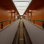 Alcino Soutinho's Department of Chemistry, University of Aveiro, showcasing a symmetrical interior design with wood flooring, composite materials, and ample daylighting.