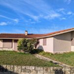 Alcino Soutinho's Holiday House in Praia de Suave-Mar showcasing a modern residential design with a prominent facade, sloped roof, and integration into the rural landscape.