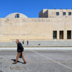 Alcino Soutinho’s Matosinhos Town Hall showcasing a brutalist architecture style with exposed concrete surfaces, large rectangular forms, and an open public space with people walking during daytime.