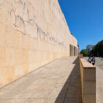 Alcino Soutinho’s Matosinhos Town Hall showcasing a modern concrete structure with composite material elements and dynamic shadow patterns on the façade.